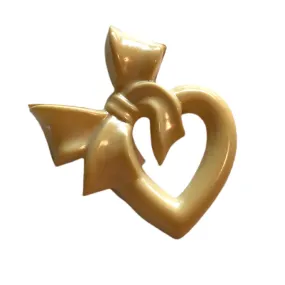 Ivory Celluloid Cartoon Heart and Bow Brooch circa 1930s